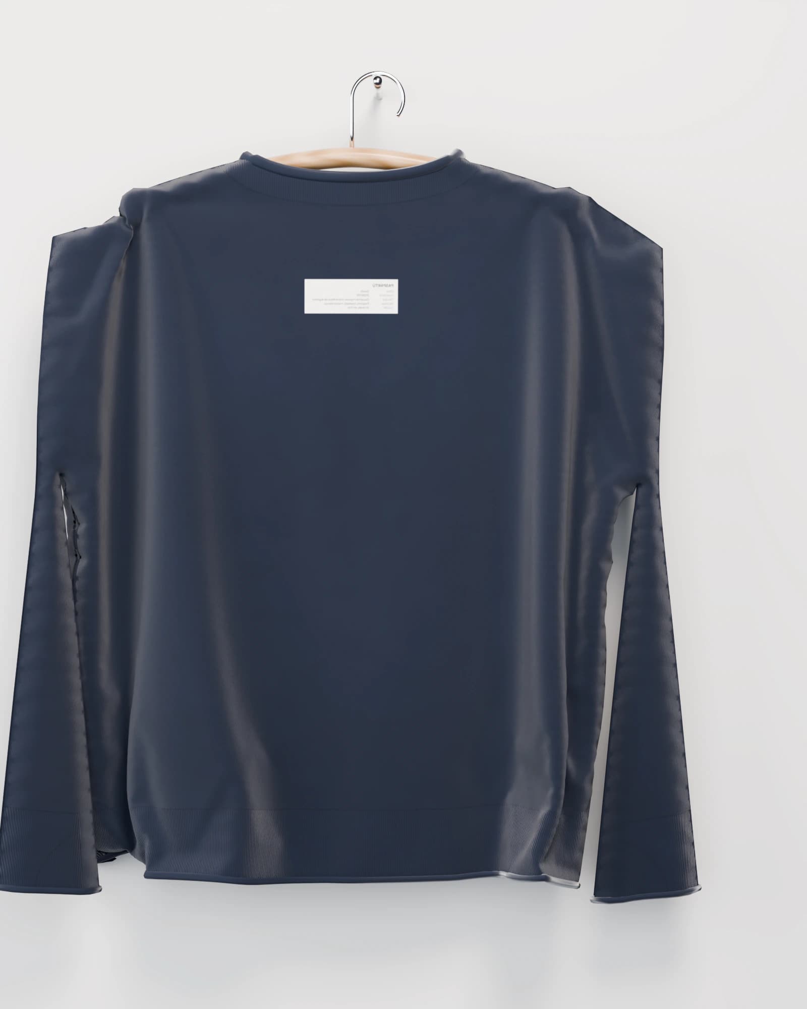 Polerón color azul marino vista por detrás, la espalda con la etiqueta de inventario de la obra estampada bajo el cuello